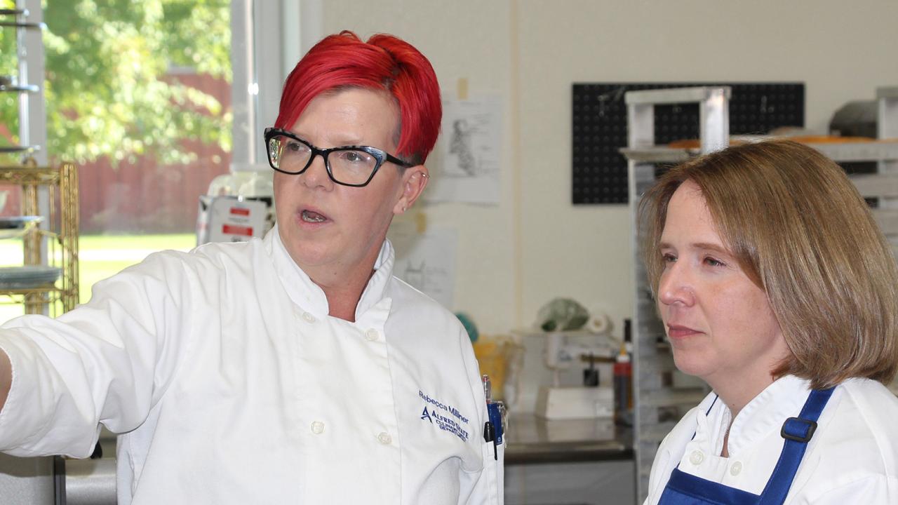 VP Cokely speaks with Culinary Arts instructor Rebecca Milner