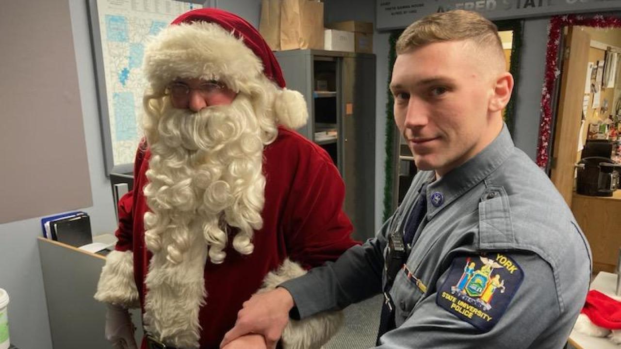 Officer checks Santa's ID