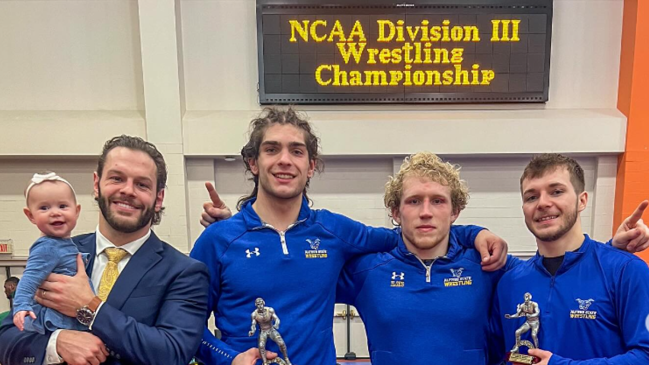 wrestlers show off their awards