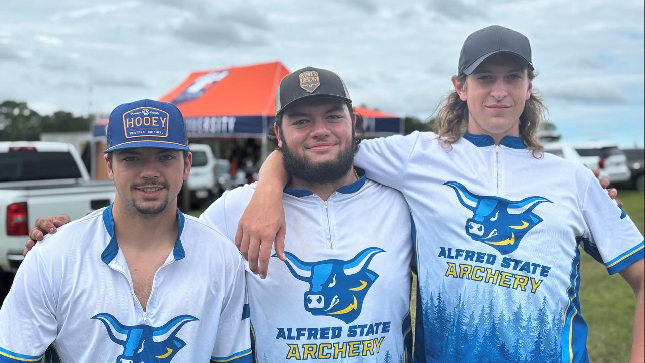 archery team members pose