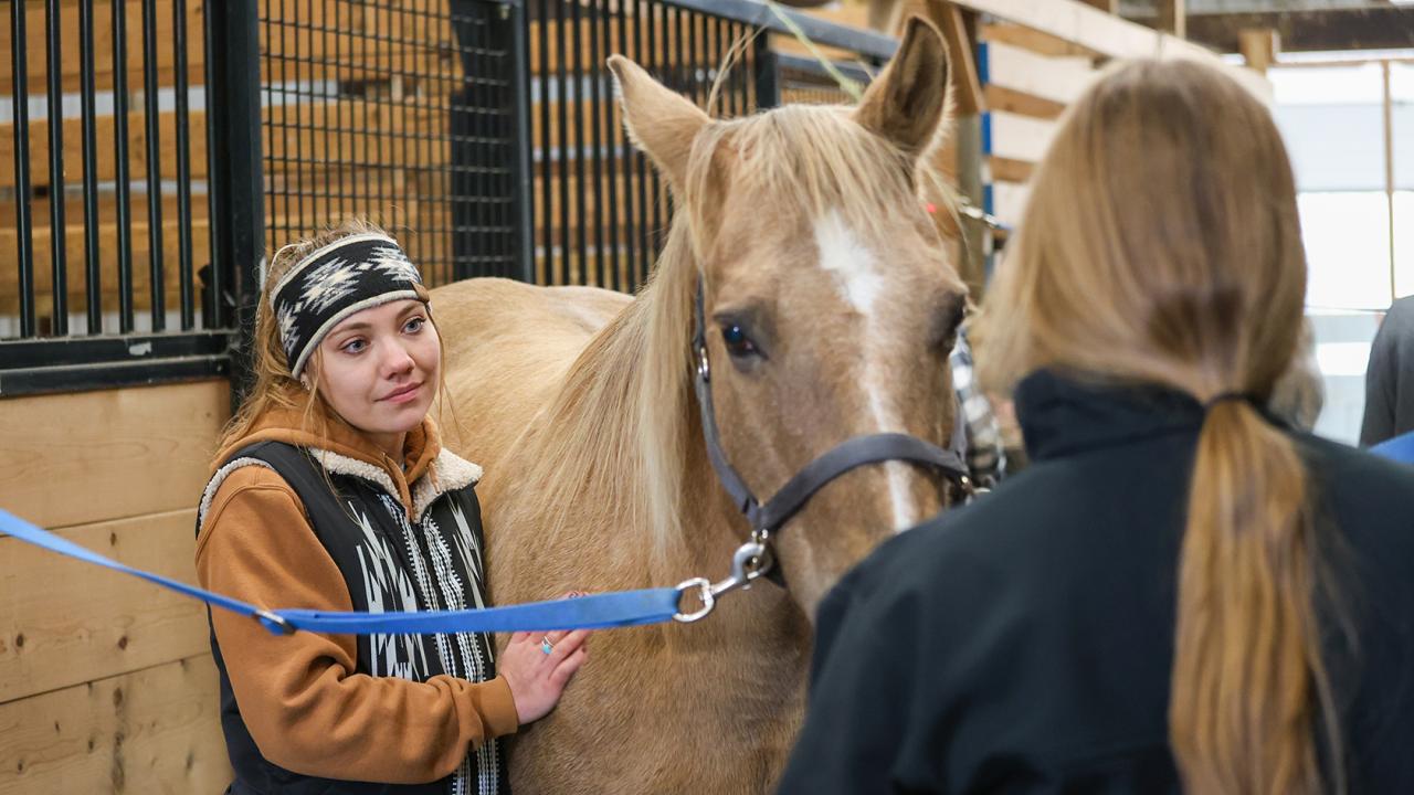 student with a horse