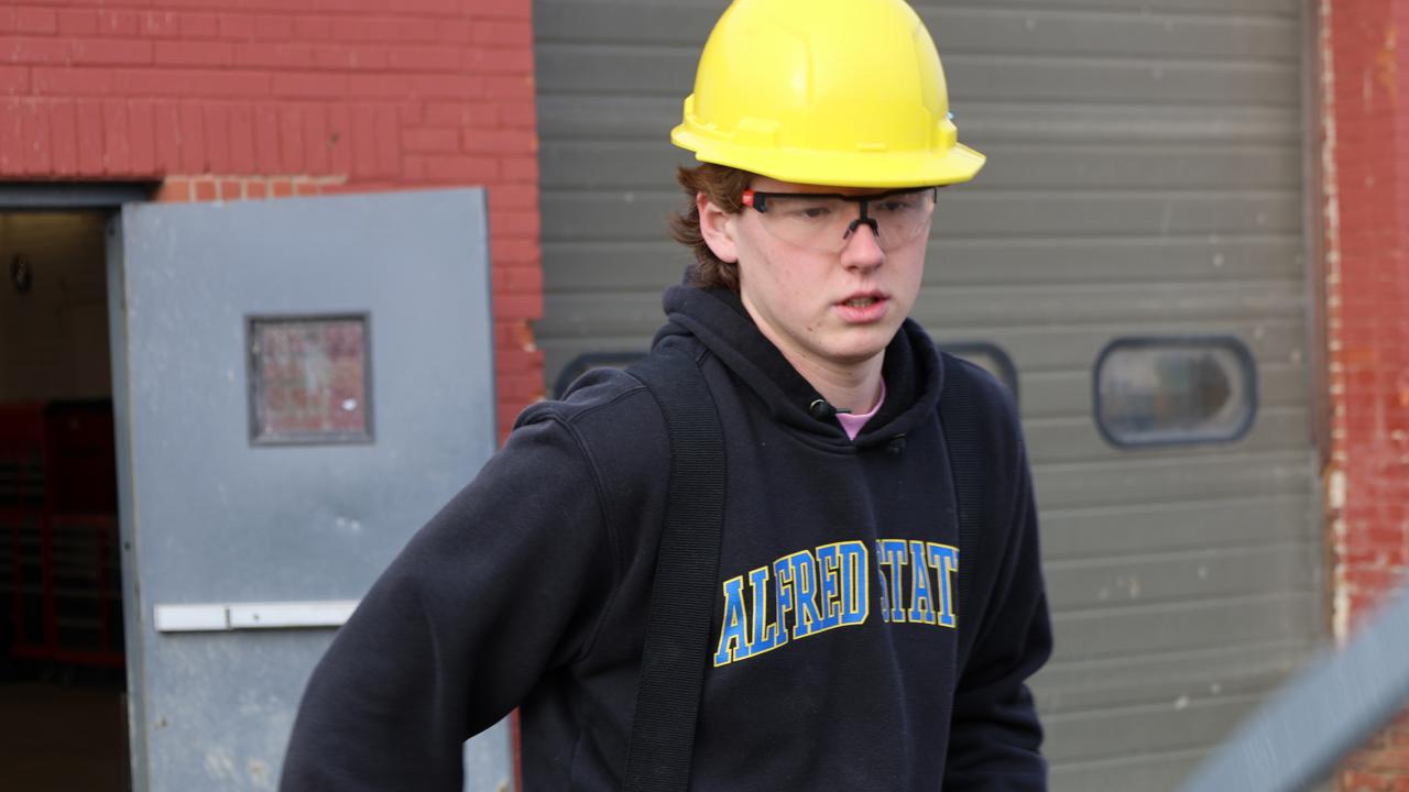student works at a job site