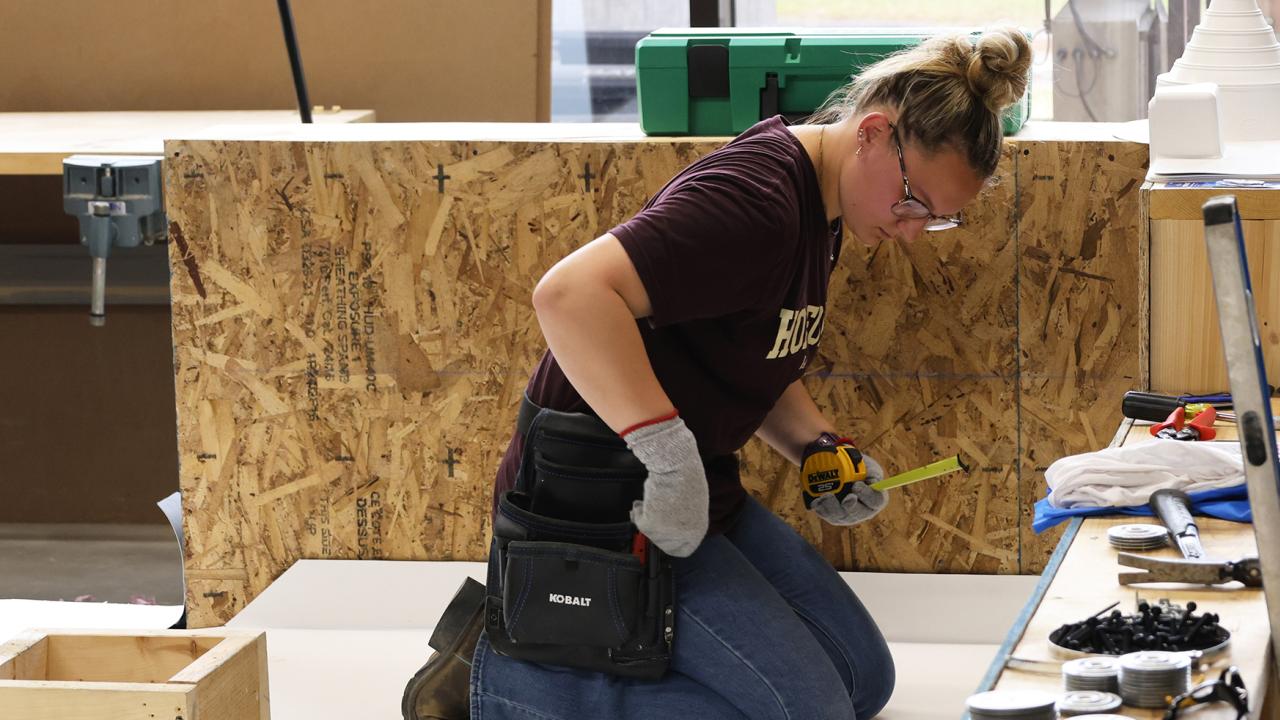 student works in a roof competition