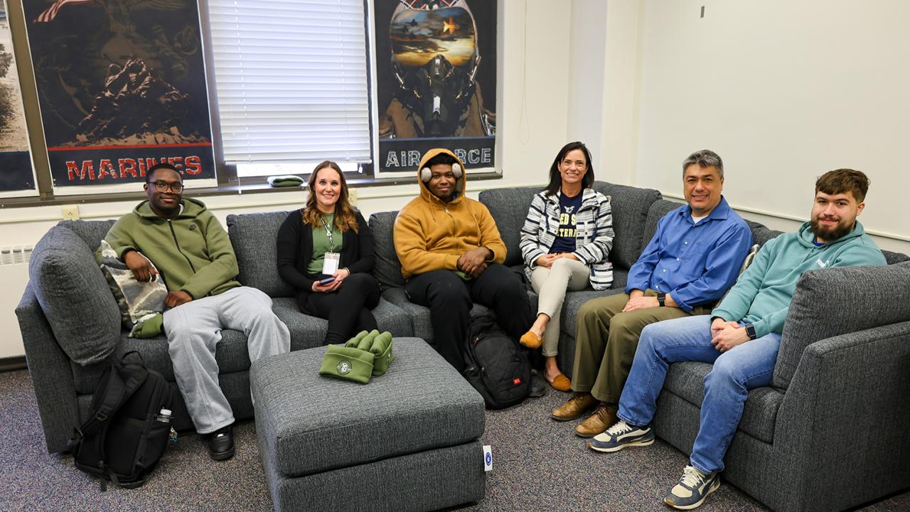 Veterans sit on the new couch in their lounge