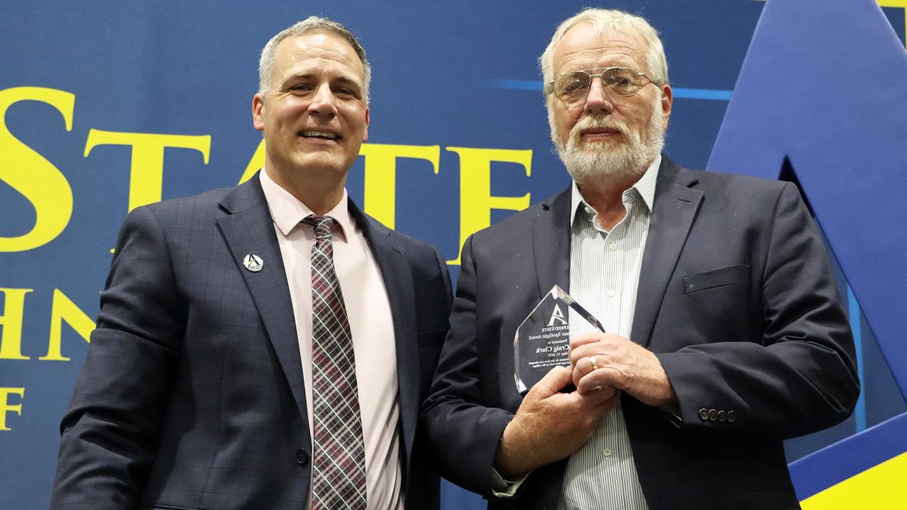 Craig Clark with Dr. Steven Mauro. Clark was awarded the Pioneer Spotlight Award