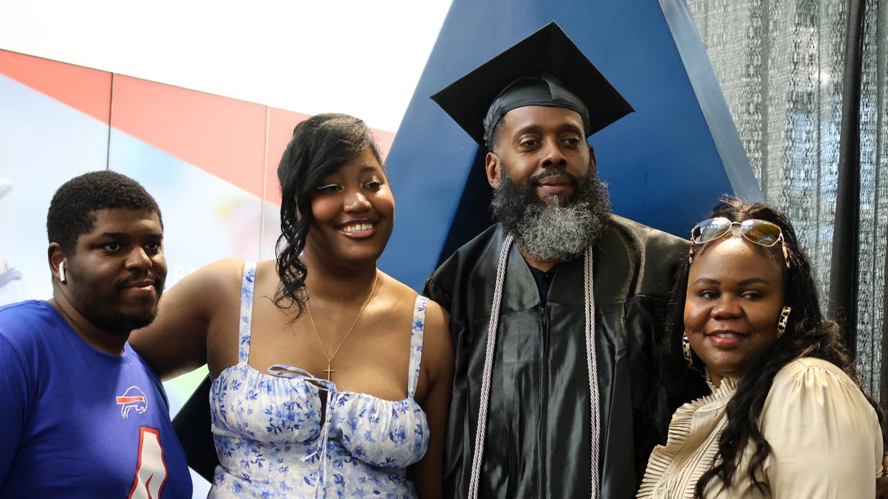 graduate celebrates with family at Northland commencement