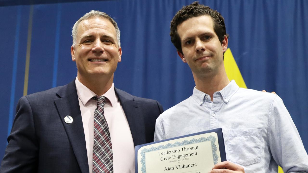Alan Vlakancic with Dr. Mauro after receiving award