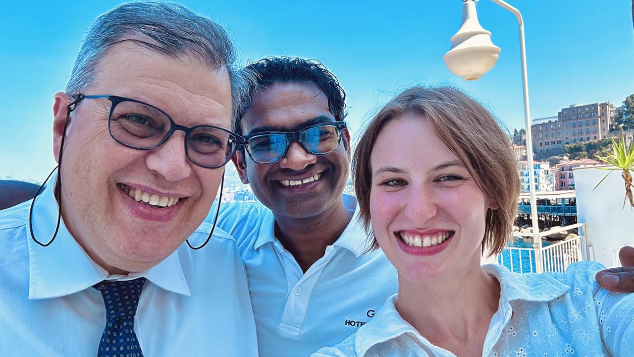 Emma with a pair of her fellow employees