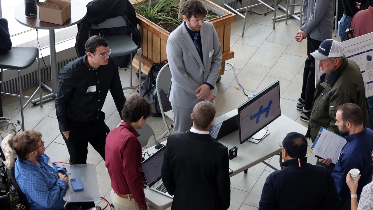 students discuss a presentation