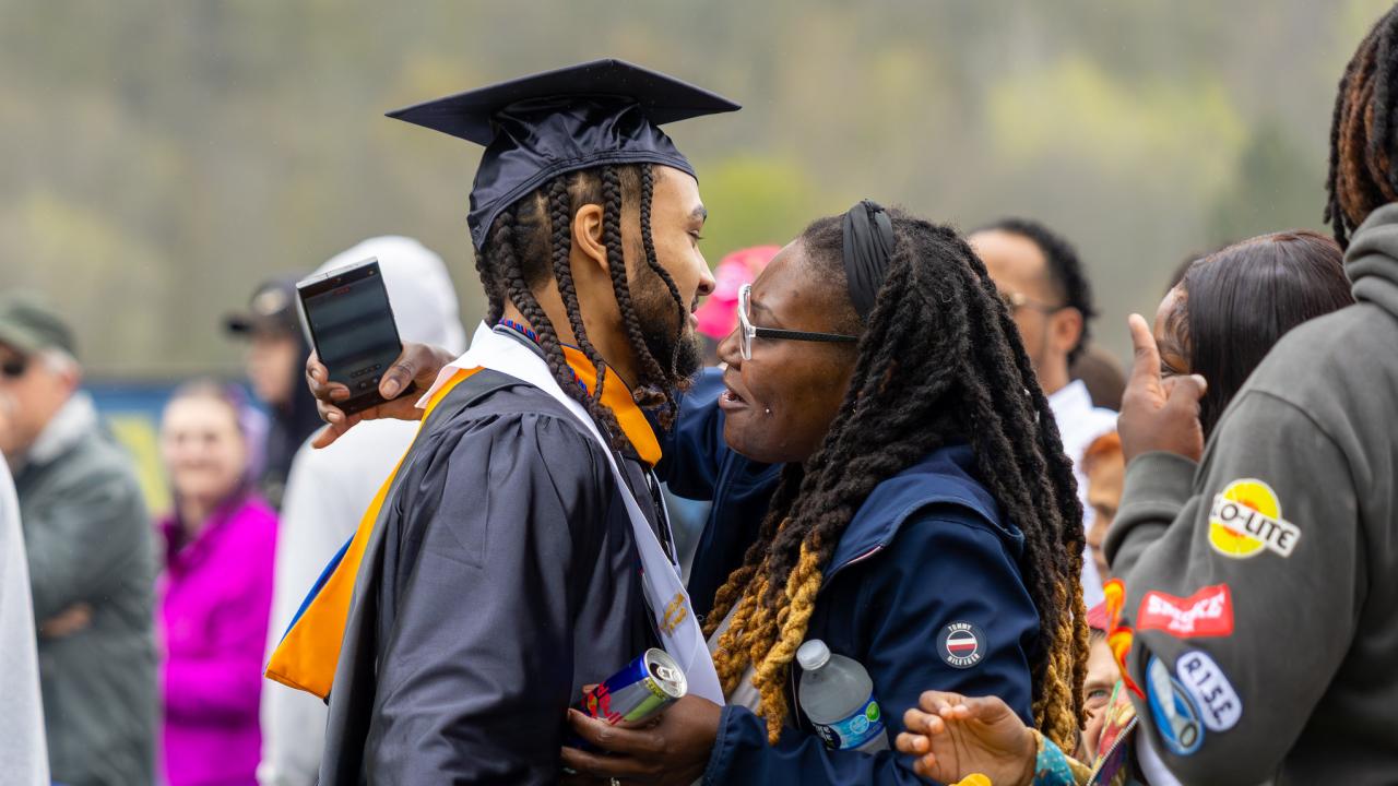 student celebrates with a parent